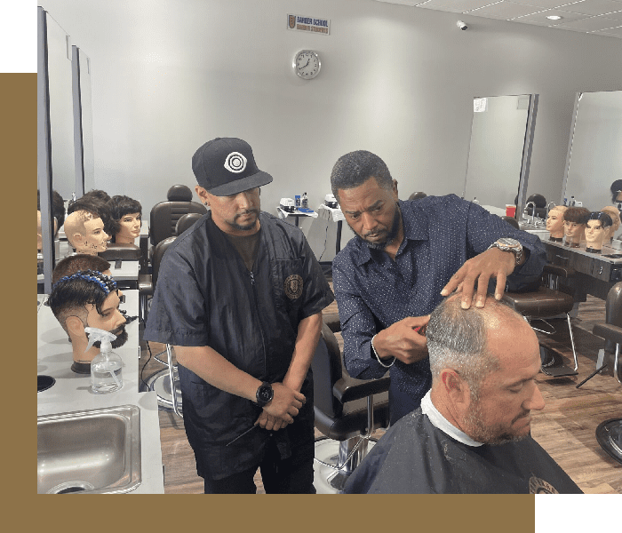 Two men are getting their heads shaved in a barber shop.