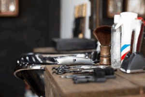 Assortment of professional barbering tools neatly arranged.